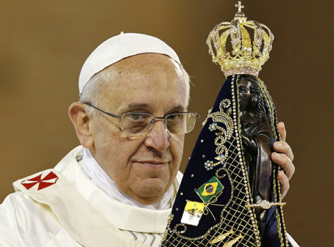 Pope Francis hold statue of Mary during Mass at Basilica of the National Shrine of Our Lady of Aparecida