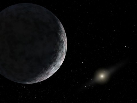 This artist's concept shows the planet catalogued as 2003UB313 at the lonely outer fringes of our solar system. Our Sun can be seen in the distance. The new planet, which is yet to be formally named, is at least as big as Pluto and about three times farther away from the Sun than Pluto. It is very cold and dark. The planet was discovered by the Samuel Oschin Telescope at the Palomar Observatory near San Diego, Calif., on Jan. 8, 2005. Image credit: NASA/JPL-Caltech