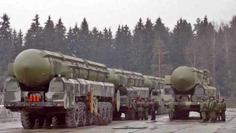 March 18, 2008: Russian Topol ICBMs behind a barbed-wire fence during a repetition for the nation's annual May 9 Victory Day parade 50 km outside Moscow in Yushkovo. On March 26, 2010 the new US-Russia nuclear pact establishes a "legally-binding" linkage between offensive strategic weapons and missile defence systems, the Kremlin said. Russia and the United States announced on March 26 that they had sealed a new nuclear disarmament accord after months of protracted negotiations to replace the START treaty. AFP PHOTO / DIMA KOROTAYEV